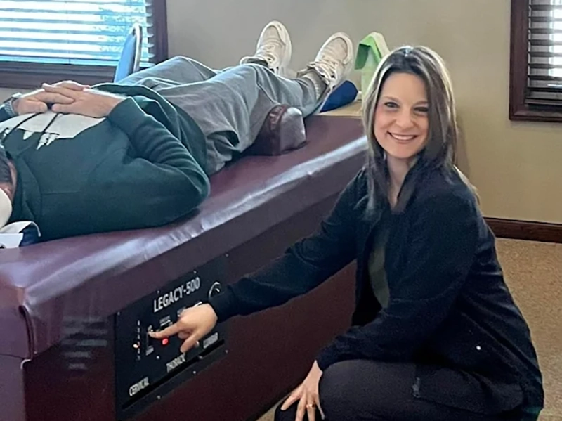 Lisa helping a Chiropractic patient